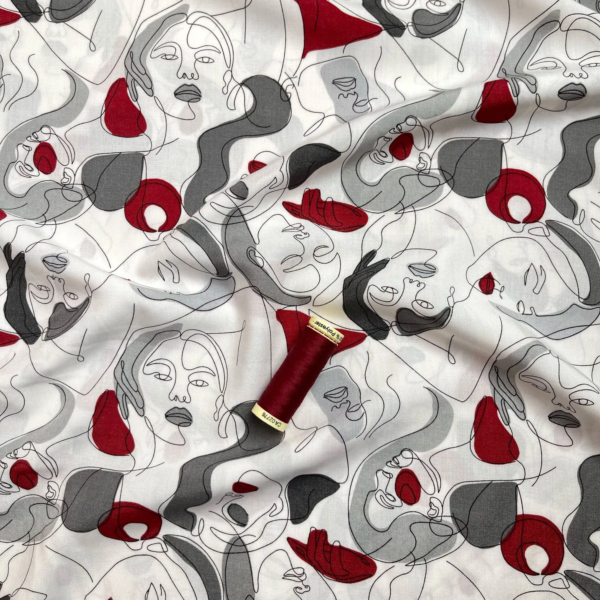 Faces on Grey Viscose Fabric