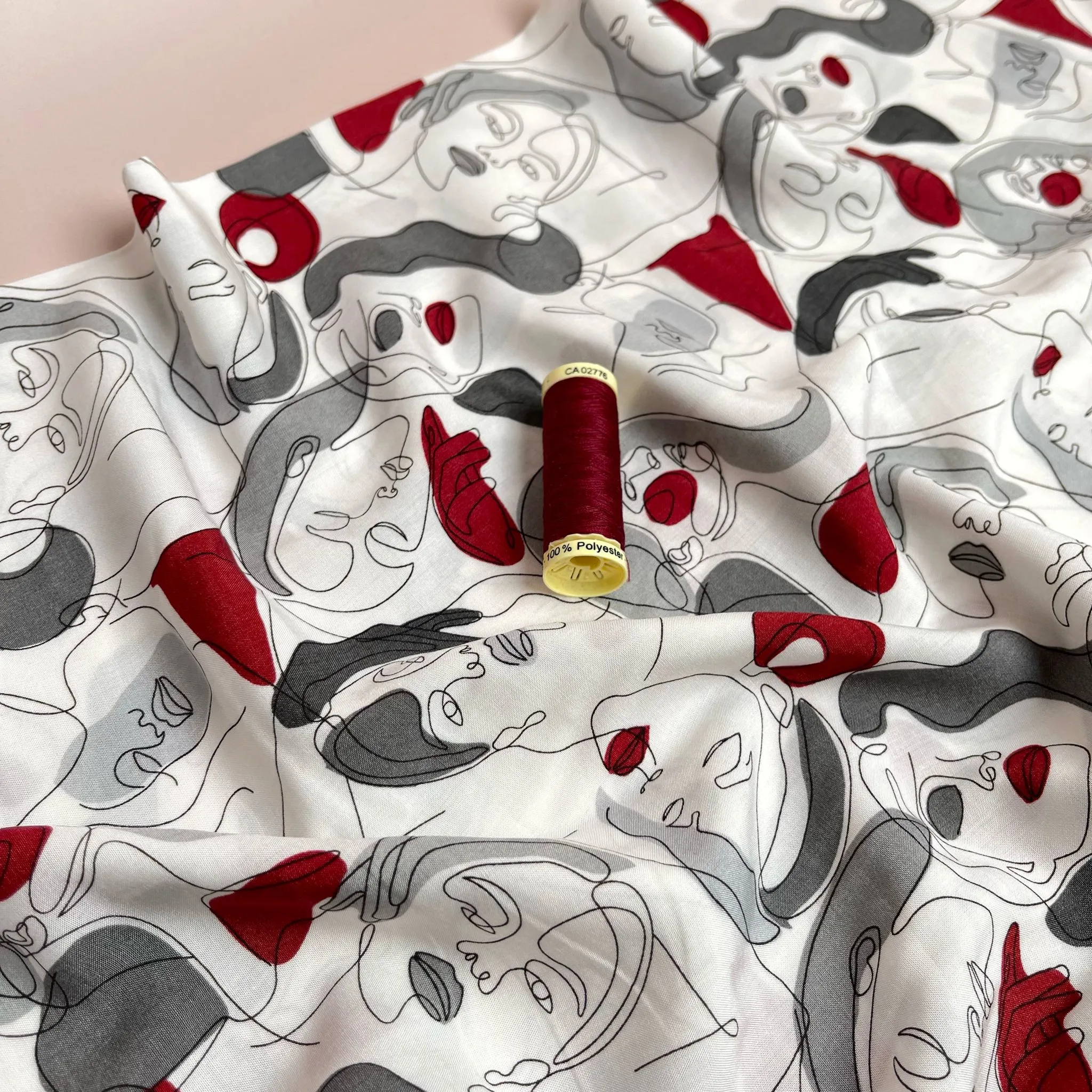 Faces on Grey Viscose Fabric