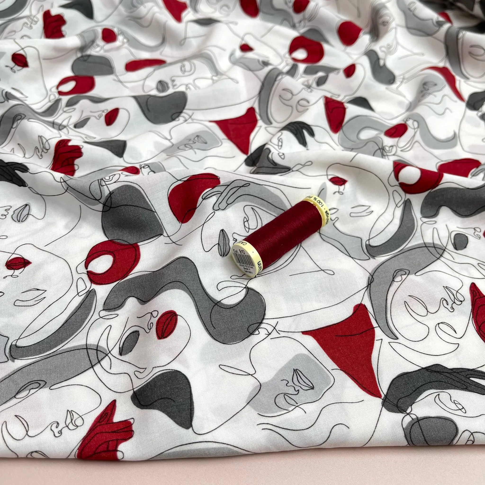 Faces on Grey Viscose Fabric