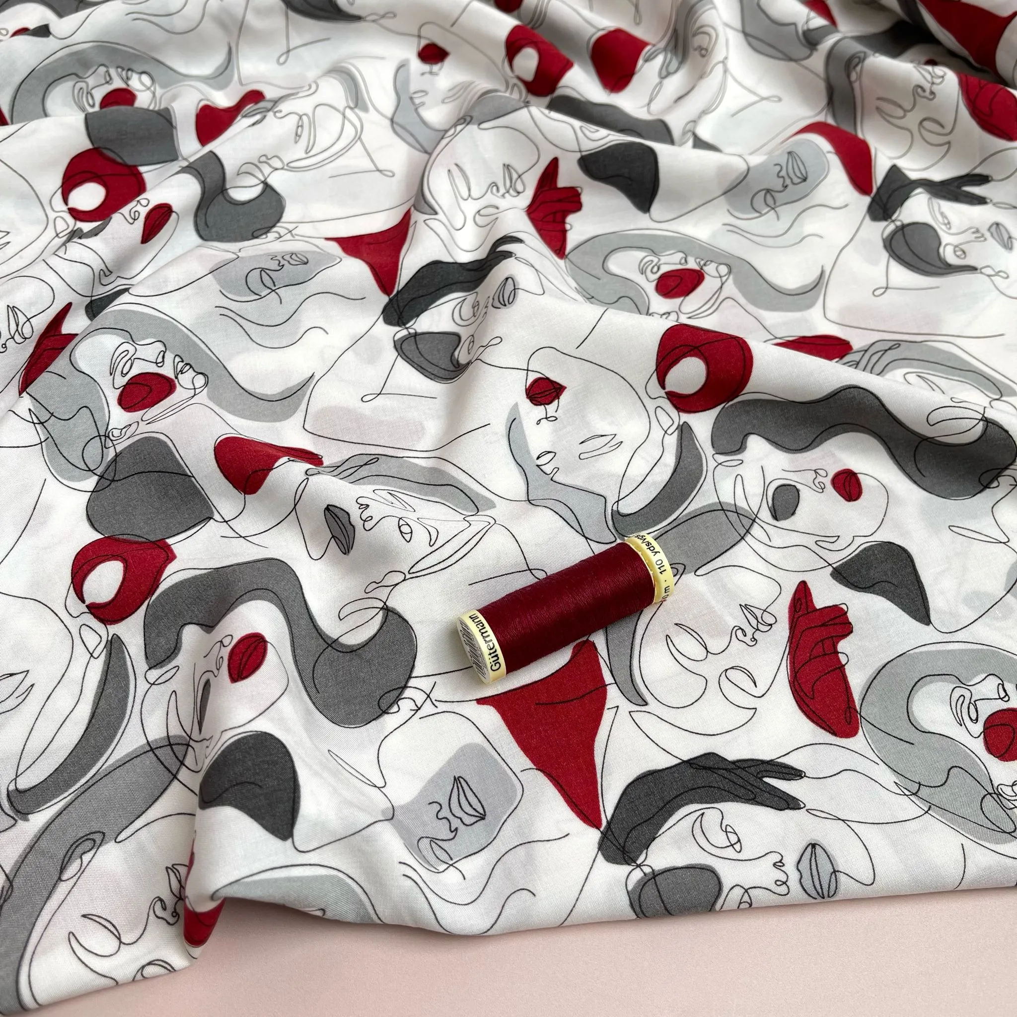 Faces on Grey Viscose Fabric